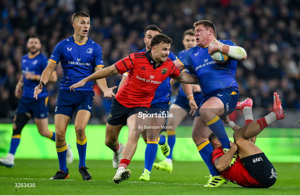 18 October 2025; Tadhg Furlong of Leinster is tackled by Tom Farrell, right, and Shane Daly of Munster during the United Rugby Championship match between Leinster and Munster at Croke Park in Dublin. Photo by Brendan Moran/Sportsfile
