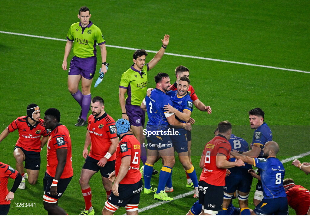 18 October 2025; Rónan Kelleher of Leinster, centre, left, celebrates with teammate Jordan Larmour after scoring their side's first try during the United Rugby Championship match between Leinster and Munster at Croke Park in Dublin. Photo by Sam Barnes/Sportsfile