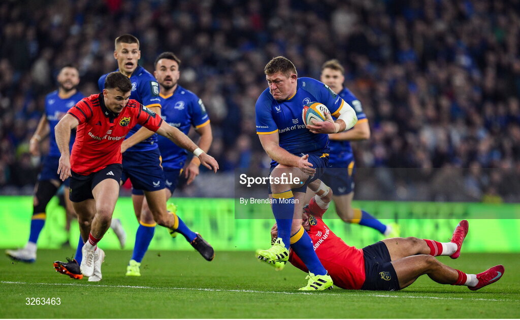18 October 2025; Tadhg Furlong of Leinster is tackled by Tom Farrell of Munster during the United Rugby Championship match between Leinster and Munster at Croke Park in Dublin. Photo by Brendan Moran/Sportsfile