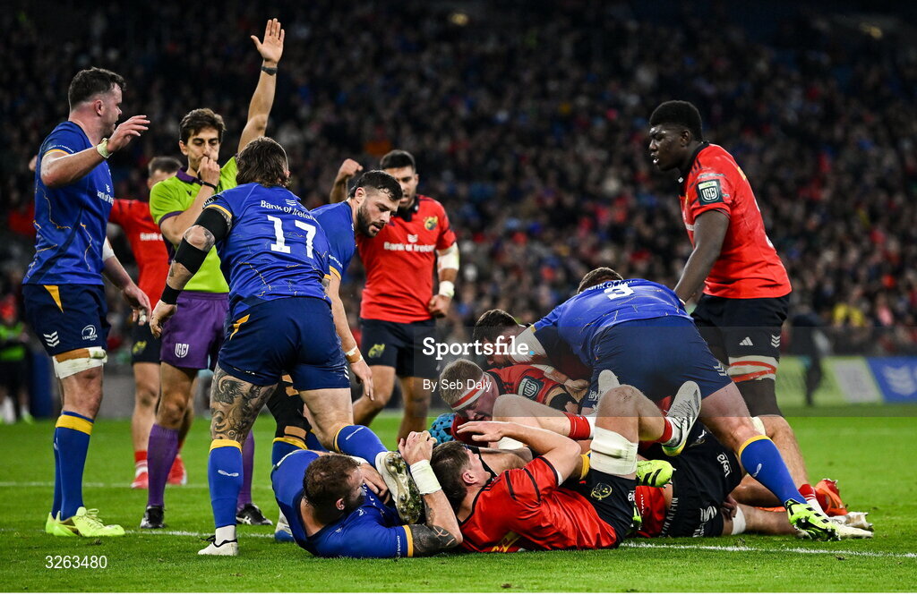 18 October 2025; Brian Gleeson of Munster, hidden, scores his side's first try during the United Rugby Championship match between Leinster and Munster at Croke Park in Dublin. Photo by Seb Daly/Sportsfile