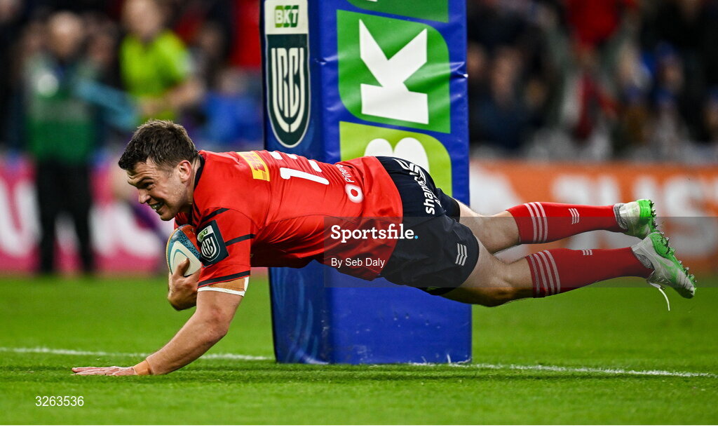 18 October 2025; Tom Farrell of Munster dives over to score his side's second try during the United Rugby Championship match between Leinster and Munster at Croke Park in Dublin. Photo by Seb Daly/Sportsfile