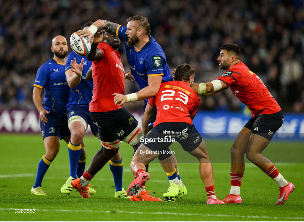 18 October 2025; RG Snyman of Leinster is tackled by Alex Nankivell, 23, and Edwin Edogbo of Munster during the United Rugby Championship match between Leinster and Munster at Croke Park in Dublin. Photo by Brendan Moran/Sportsfile