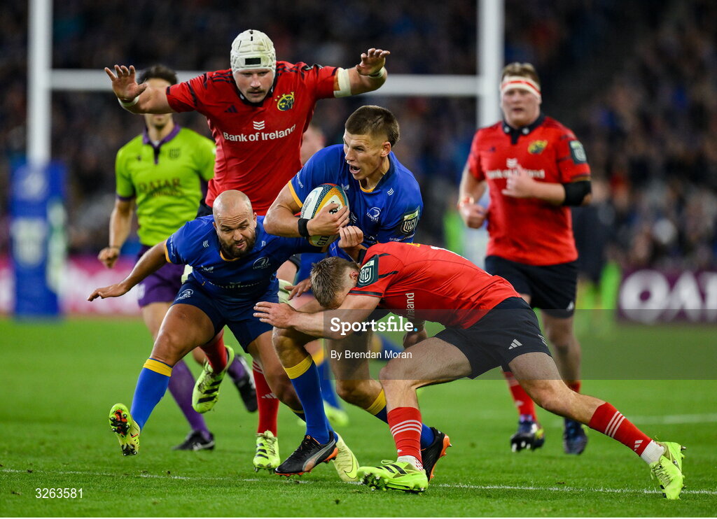18 October 2025; Sam Prendergast of Leinster is tackled by Jack Crowley of Munster during the United Rugby Championship match between Leinster and Munster at Croke Park in Dublin. Photo by Brendan Moran/Sportsfile