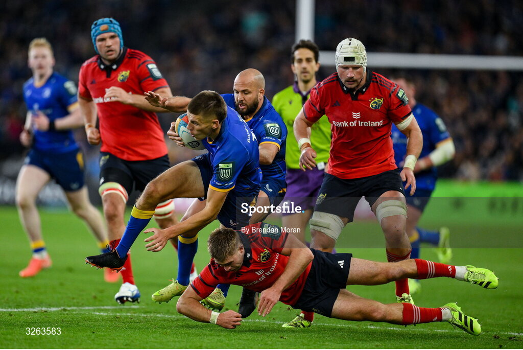 18 October 2025; Sam Prendergast of Leinster is tackled by Jack Crowley of Munster during the United Rugby Championship match between Leinster and Munster at Croke Park in Dublin. Photo by Brendan Moran/Sportsfile