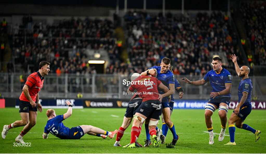 18 October 2025; Sam Prendergast of Leinster is tackled by Ethan Coughlan, hidden, and Fineen Wycherley of Munster during the United Rugby Championship match between Leinster and Munster at Croke Park in Dublin. Photo by Brendan Moran/Sportsfile