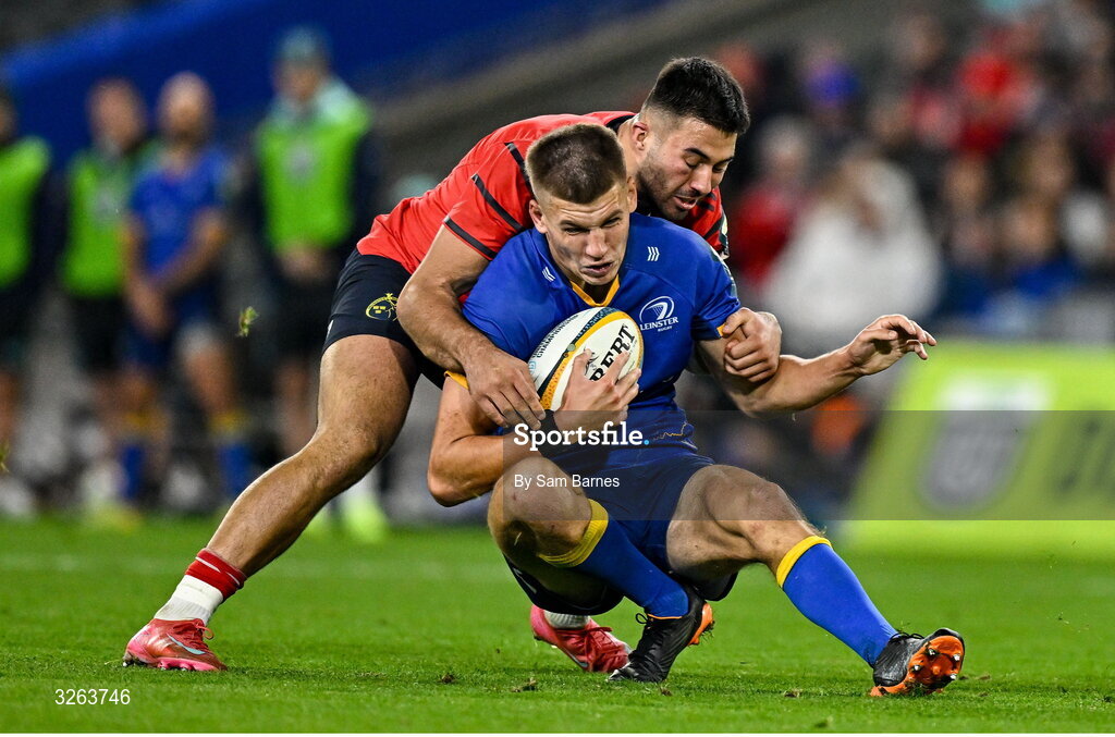 18 October 2025; Sam Prendergast of Leinster is tackled by Dan Kelly of Munster during the United Rugby Championship match between Leinster and Munster at Croke Park in Dublin. Photo by Sam Barnes/Sportsfile