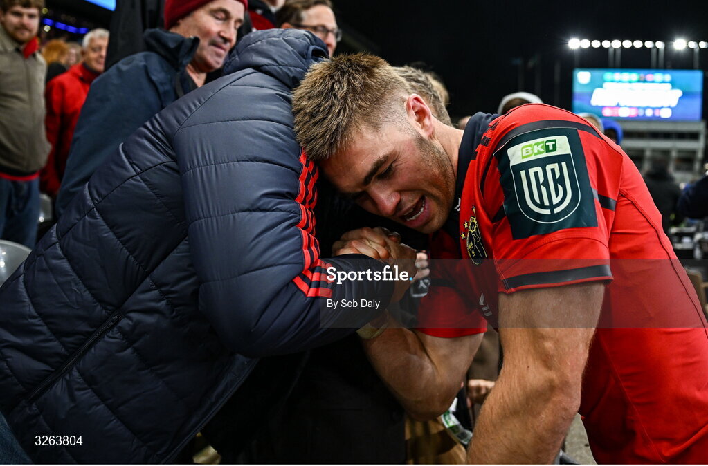 18 October 2025; Jack Crowley of Munster celebrates with his father Fachtna after the United Rugby Championship match between Leinster and Munster at Croke Park in Dublin. Photo by Seb Daly/Sportsfile