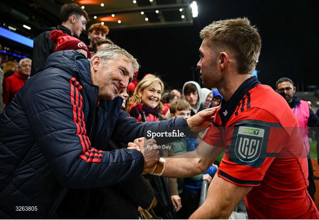 18 October 2025; Jack Crowley of Munster celebrates with his father Fachtna after the United Rugby Championship match between Leinster and Munster at Croke Park in Dublin. Photo by Seb Daly/Sportsfile