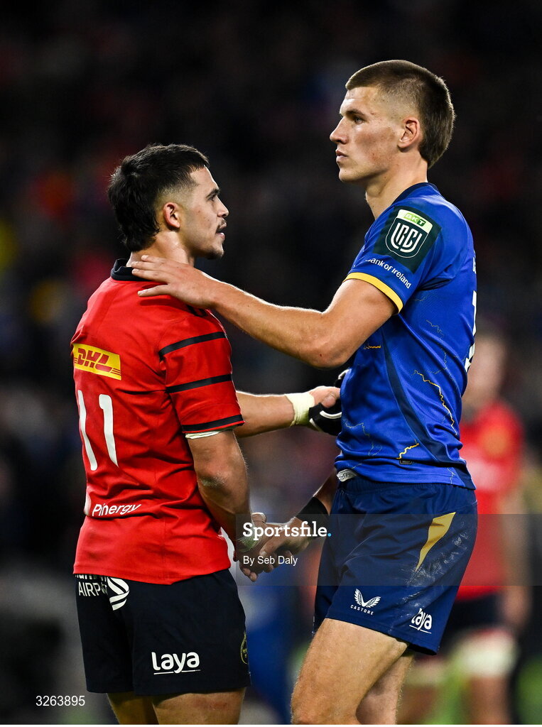 18 October 2025; Thaakir Abrahams of Munster and Sam Prendergast of Leinster shake hands after the United Rugby Championship match between Leinster and Munster at Croke Park in Dublin. Photo by Seb Daly/Sportsfile