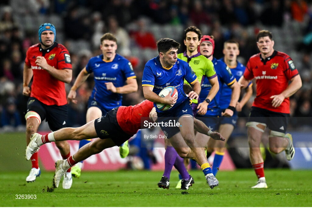 18 October 2025; Jimmy O'Brien of Leinster is tackled by Shane Daly of Munster during the United Rugby Championship match between Leinster and Munster at Croke Park in Dublin. Photo by Seb Daly/Sportsfile