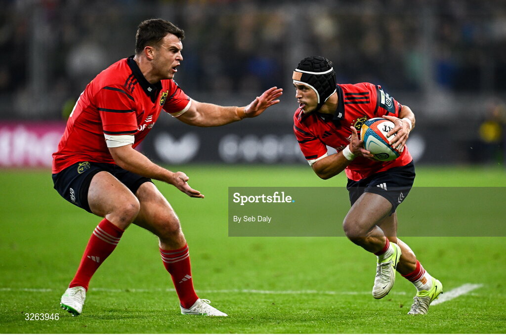 18 October 2025; Thaakir Abrahams of Munster, right, and teammate Tom Farrell during the United Rugby Championship match between Leinster and Munster at Croke Park in Dublin. Photo by Seb Daly/Sportsfile
