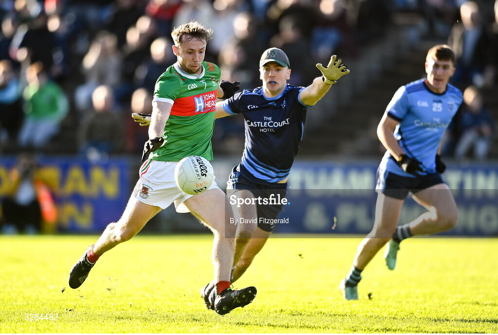 19 October 2025; David Tighe of Ballina Stephenites gets past Westport goalkeeper Paddy O'Malley and shoots but hits the post during the Mayo County Senior Club Football Championship final match between Ballina Stephenites and Westport at Hastings Insurance MacHale Park in Castlebar, Mayo. Photo by David Fitzgerald/Sportsfile