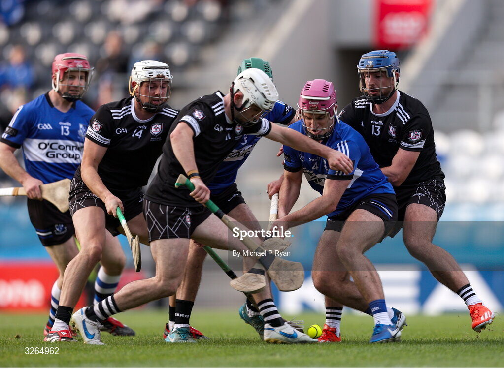 19 October 2025; Donal English of Sarsfields in action against Alex Quirke of Midleton during the Cork County Senior Club Hurling Championship final match between Sarsfields and Midleton at SuperValu Páirc Uí Chaoimh in Cork. Photo by Michael P Ryan/Sportsfile