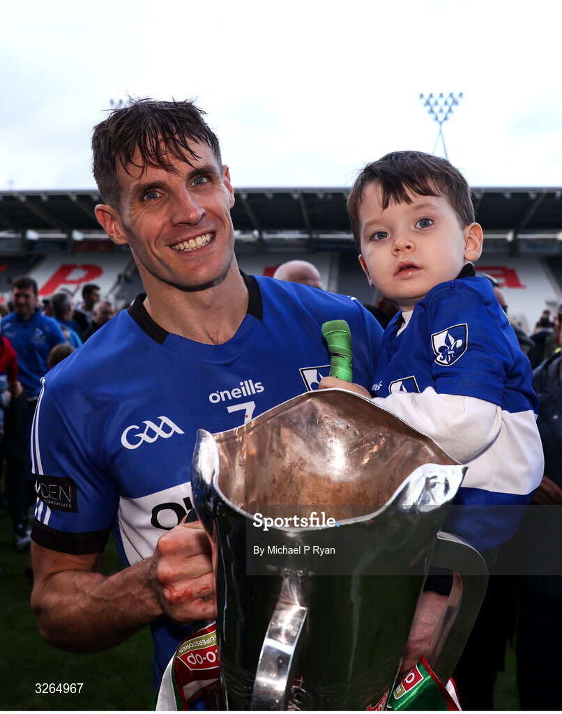 19 October 2025; Craig Leahy of Sarsfields with his son Sam, age 3, after the Cork County Senior Club Hurling Championship final match between Sarsfields and Midleton at SuperValu Páirc Uí Chaoimh in Cork. Photo by Michael P Ryan/Sportsfile