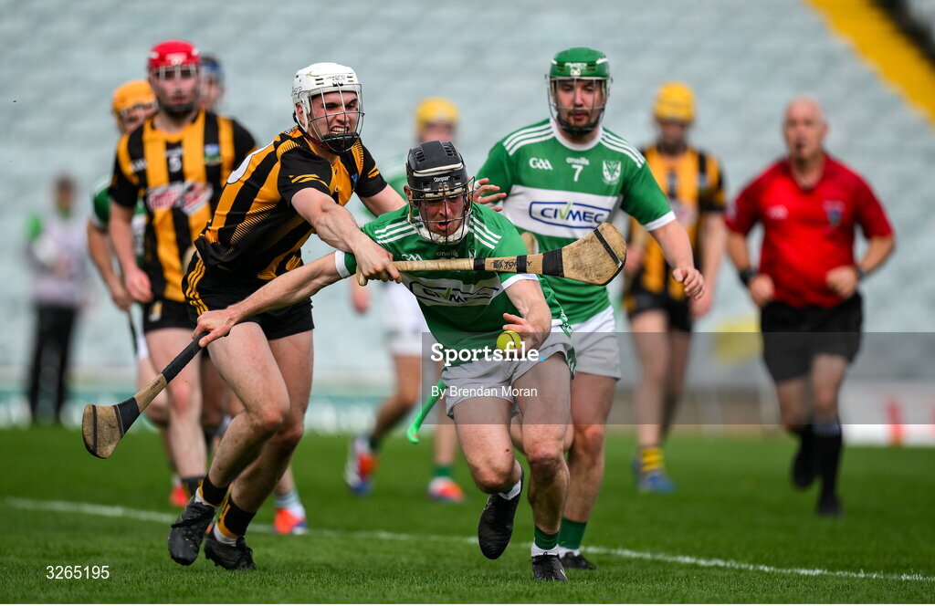 19 October 2025; Gordon Brown of Na Piarsaigh is tackled by Robert Sampson of Garryspillane during the Limerick Premier Intermediate Hurling final match between Garryspilane and Effin at TUS Gaelic Grounds in Limerick. Photo by Brendan Moran/Sportsfile