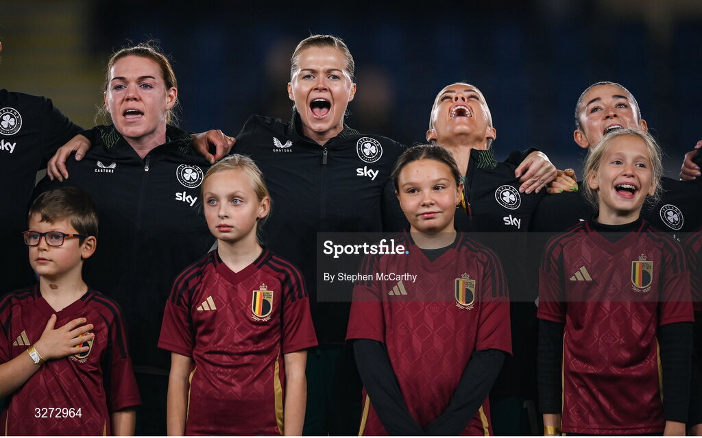 28 October 2025; Republic of Ireland players, from left, Aoife Mannion, Ruesha Littlejohn, Denise O’Sullivan and Marissa Sheva during Amhrán na bhFiann before the UEFA Women's Nations League A/B promotion/relegation play-off second leg match between Belgium and Republic of Ireland at The King Power At Den Dreef Stadium in Leuven, Belgium. Photo by Stephen McCarthy/Sportsfile