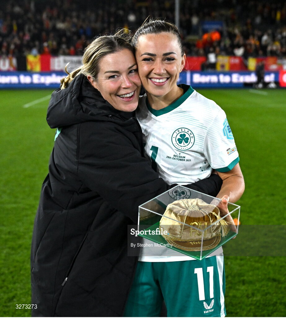28 October 2025; Katie McCabe of Republic of Ireland, left, holds her 100th cap alongside Republic of Ireland goalkeeping coach Emma Byrne after the UEFA Women's Nations League A/B promotion/relegation play-off second leg match between Belgium and Republic of Ireland at The King Power At Den Dreef Stadium in Leuven, Belgium. Photo by Stephen McCarthy/Sportsfile