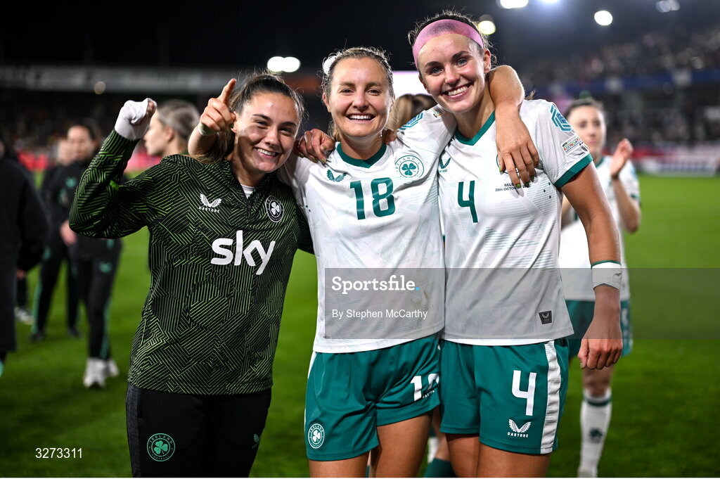 28 October 2025; Republic of Ireland players, from left, Jess Ziu, Kyra Carusa and Caitlin Hayes celebrate after the UEFA Women's Nations League A/B promotion/relegation play-off second leg match between Belgium and Republic of Ireland at The King Power At Den Dreef Stadium in Leuven, Belgium. Photo by Stephen McCarthy/Sportsfile