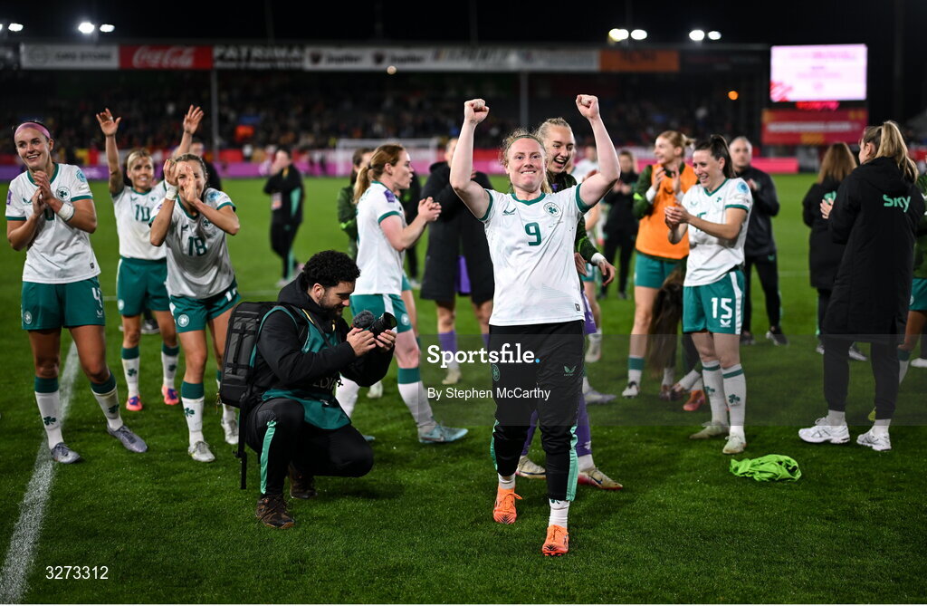28 October 2025; Republic of Ireland players and staff, including Amber Barrett, centre, celebrate after the UEFA Women's Nations League A/B promotion/relegation play-off second leg match between Belgium and Republic of Ireland at The King Power At Den Dreef Stadium in Leuven, Belgium. Photo by Stephen McCarthy/Sportsfile