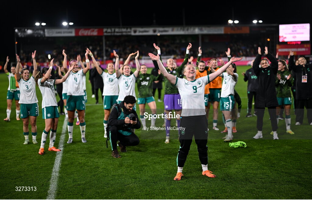 28 October 2025; Republic of Ireland players and staff, including Amber Barrett, centre, celebrate after the UEFA Women's Nations League A/B promotion/relegation play-off second leg match between Belgium and Republic of Ireland at The King Power At Den Dreef Stadium in Leuven, Belgium. Photo by Stephen McCarthy/Sportsfile