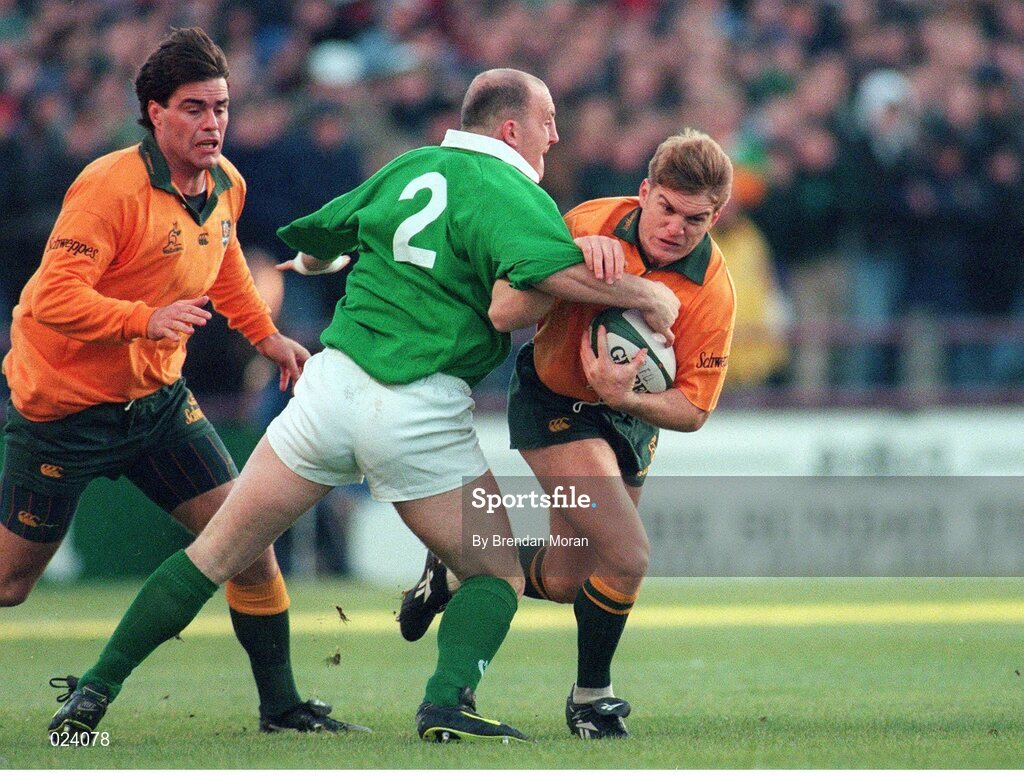 23 November 1996; Australia's Tim Horan in action against Ireland's Keith Wood. International Friendly, Ireland v Australia, Lansdowne Road, Dublin. Picture credit: Brendan Moran / SPORTSFILE