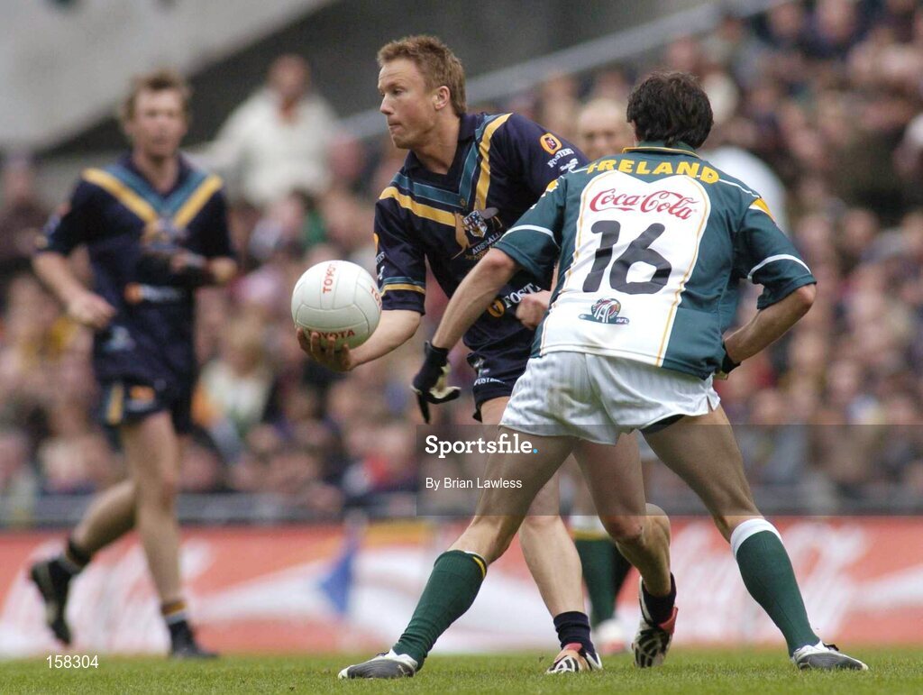17 October 2004; Nathan Brown, Australia, in action against Tadhg Kennelly, Ireland. Coca Cola International Rules Series 2004, First Test, Ireland v Australia, Croke Park, Dublin. Picture credit; Brian Lawless / SPORTSFILE *** Local Caption *** Any photograph taken by SPORTSFILE during, or in connection with, the 2004 Coca Cola International Rules Series which displays GAA logos or contains an image or part of an image of any GAA intellectual property, or, which contains images of a GAA player/players in their playing uniforms, may only be used for editorial and non-advertising purposes.  Use of photographs for advertising, as posters or for purchase separately is strictly prohibited unless prior written approval has been obtained from the Gaelic Athletic Association.