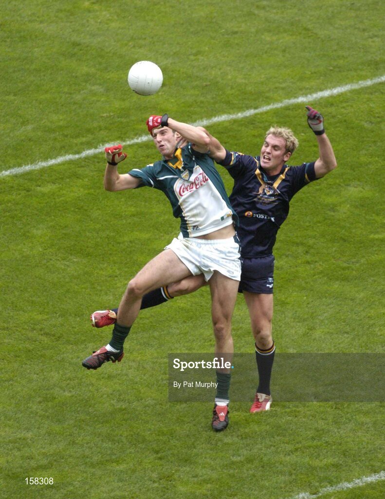 17 October 2004; Joe Bergin, Ireland, in action against Cameron Bruce, Australia. Coca Cola International Rules Series 2004, First Test, Ireland v Australia, Croke Park, Dublin. Picture credit; Pat Murphy / SPORTSFILE *** Local Caption *** Any photograph taken by SPORTSFILE during, or in connection with, the 2004 Coca Cola International Rules Series which displays GAA logos or contains an image or part of an image of any GAA intellectual property, or, which contains images of a GAA player/players in their playing uniforms, may only be used for editorial and non-advertising purposes.  Use of photographs for advertising, as posters or for purchase separately is strictly prohibited unless prior written approval has been obtained from the Gaelic Athletic Association.