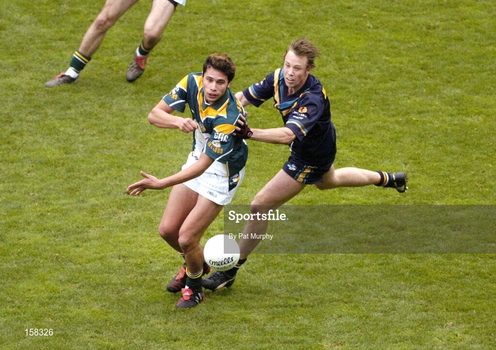 17 October 2004; Setanta O'hAilpin, Ireland, in action against Max Hudghton, Australia. Coca Cola International Rules Series 2004, First Test, Ireland v Australia, Croke Park, Dublin. Picture credit; Pat Murphy / SPORTSFILE *** Local Caption *** Any photograph taken by SPORTSFILE during, or in connection with, the 2004 Coca Cola International Rules Series which displays GAA logos or contains an image or part of an image of any GAA intellectual property, or, which contains images of a GAA player/players in their playing uniforms, may only be used for editorial and non-advertising purposes.  Use of photographs for advertising, as posters or for purchase separately is strictly prohibited unless prior written approval has been obtained from the Gaelic Athletic Association.