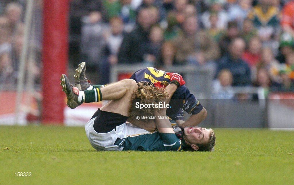 17 October 2004; Matty Forde, Ireland, in a tussle with Mark McVeigh, Australia, for which McVeigh received a yellow card and was sin-binned. Coca Cola International Rules Series 2004, First Test, Ireland v Australia, Croke Park, Dublin. Picture credit; Brendan Moran / SPORTSFILE *** Local Caption *** Any photograph taken by SPORTSFILE during, or in connection with, the 2004 Coca Cola International Rules Series which displays GAA logos or contains an image or part of an image of any GAA intellectual property, or, which contains images of a GAA player/players in their playing uniforms, may only be used for editorial and non-advertising purposes.  Use of photographs for advertising, as posters or for purchase separately is strictly prohibited unless prior written approval has been obtained from the Gaelic Athletic Association.