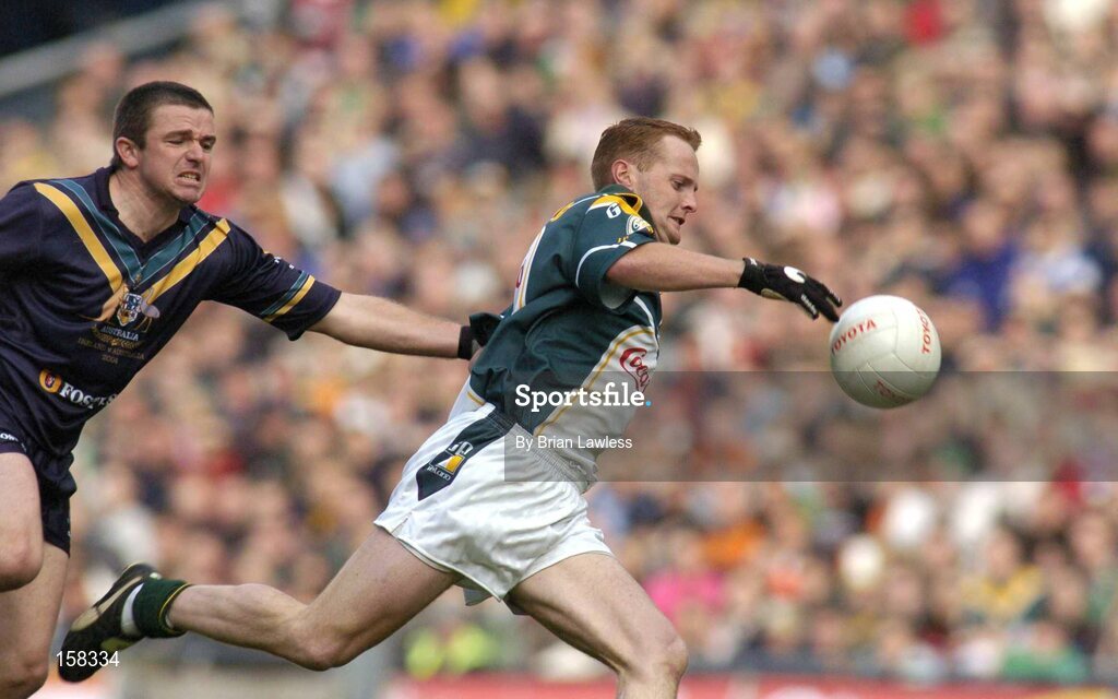 17 October 2004; Brendan Coulter, Ireland, in action against Austinn Jones, Australia. Coca Cola International Rules Series 2004, First Test, Ireland v Australia, Croke Park, Dublin. Picture credit; Brian Lawless / SPORTSFILE *** Local Caption *** Any photograph taken by SPORTSFILE during, or in connection with, the 2004 Coca Cola International Rules Series which displays GAA logos or contains an image or part of an image of any GAA intellectual property, or, which contains images of a GAA player/players in their playing uniforms, may only be used for editorial and non-advertising purposes.  Use of photographs for advertising, as posters or for purchase separately is strictly prohibited unless prior written approval has been obtained from the Gaelic Athletic Association.