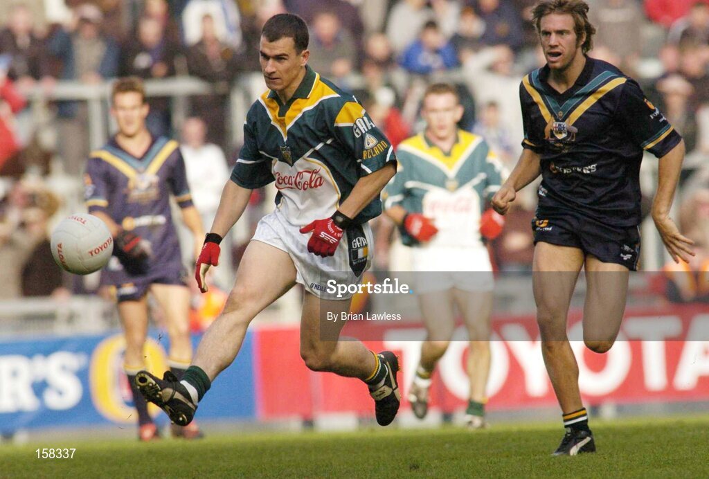 17 October 2004; Dessie Dolan, Ireland, in action against Joel Corey, Australia. Coca Cola International Rules Series 2004, First Test, Ireland v Australia, Croke Park, Dublin. Picture credit; Brian Lawless / SPORTSFILE *** Local Caption *** Any photograph taken by SPORTSFILE during, or in connection with, the 2004 Coca Cola International Rules Series which displays GAA logos or contains an image or part of an image of any GAA intellectual property, or, which contains images of a GAA player/players in their playing uniforms, may only be used for editorial and non-advertising purposes.  Use of photographs for advertising, as posters or for purchase separately is strictly prohibited unless prior written approval has been obtained from the Gaelic Athletic Association.