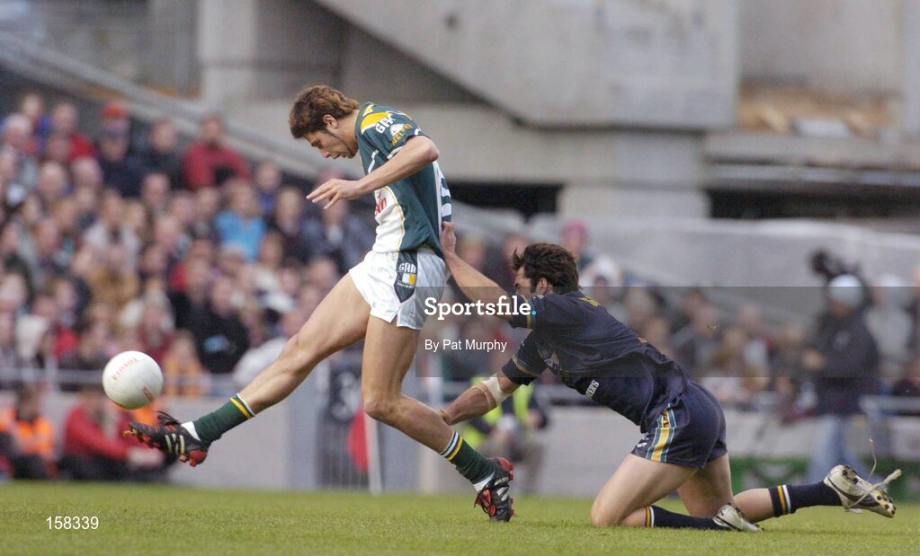 17 October 2004; Setanta O'hAilpin, Ireland, in action against Dean Solomon, Australia. Coca Cola International Rules Series 2004, First Test, Ireland v Australia, Croke Park, Dublin. Picture credit; Pat Murphy / SPORTSFILE *** Local Caption *** Any photograph taken by SPORTSFILE during, or in connection with, the 2004 Coca Cola International Rules Series which displays GAA logos or contains an image or part of an image of any GAA intellectual property, or, which contains images of a GAA player/players in their playing uniforms, may only be used for editorial and non-advertising purposes.  Use of photographs for advertising, as posters or for purchase separately is strictly prohibited unless prior written approval has been obtained from the Gaelic Athletic Association.