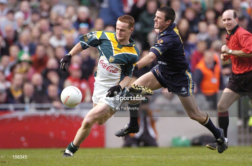 17 October 2004; Brendan Coulter, Ireland, in action against Austin Jones, Australia. Coca Cola International Rules Series 2004, First Test, Ireland v Australia, Croke Park, Dublin. Picture credit; Pat Murphy / SPORTSFILE *** Local Caption *** Any photograph taken by SPORTSFILE during, or in connection with, the 2004 Coca Cola International Rules Series which displays GAA logos or contains an image or part of an image of any GAA intellectual property, or, which contains images of a GAA player/players in their playing uniforms, may only be used for editorial and non-advertising purposes.  Use of photographs for advertising, as posters or for purchase separately is strictly prohibited unless prior written approval has been obtained from the Gaelic Athletic Association.