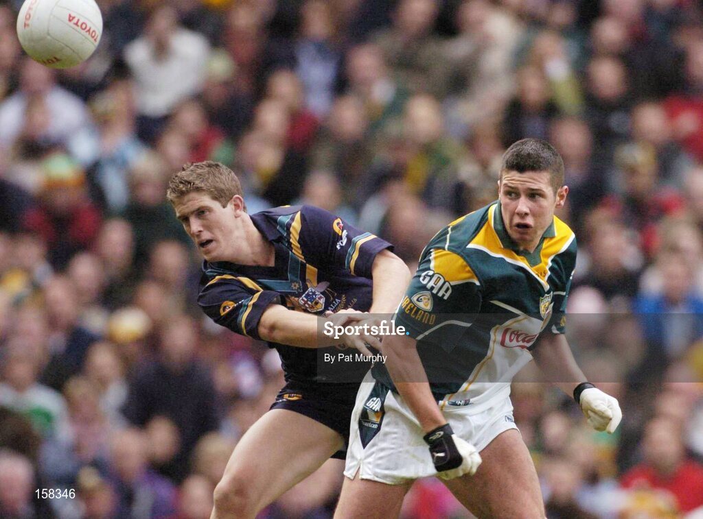 17 October 2004; Sean Cavanagh, Ireland, in action against Brady Rawlings, Australia. Coca Cola International Rules Series 2004, First Test, Ireland v Australia, Croke Park, Dublin. Picture credit; Pat Murphy / SPORTSFILE *** Local Caption *** Any photograph taken by SPORTSFILE during, or in connection with, the 2004 Coca Cola International Rules Series which displays GAA logos or contains an image or part of an image of any GAA intellectual property, or, which contains images of a GAA player/players in their playing uniforms, may only be used for editorial and non-advertising purposes.  Use of photographs for advertising, as posters or for purchase separately is strictly prohibited unless prior written approval has been obtained from the Gaelic Athletic Association.