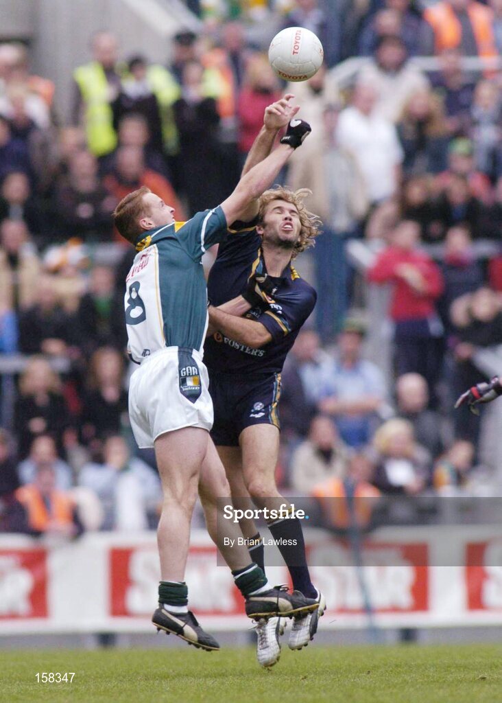 17 October 2004; Mark McVeigh, Australia, in action against Brendan Coulter, Ireland. Coca Cola International Rules Series 2004, First Test, Ireland v Australia, Croke Park, Dublin. Picture credit; Brian Lawless / SPORTSFILE *** Local Caption *** Any photograph taken by SPORTSFILE during, or in connection with, the 2004 Coca Cola International Rules Series which displays GAA logos or contains an image or part of an image of any GAA intellectual property, or, which contains images of a GAA player/players in their playing uniforms, may only be used for editorial and non-advertising purposes.  Use of photographs for advertising, as posters or for purchase separately is strictly prohibited unless prior written approval has been obtained from the Gaelic Athletic Association.