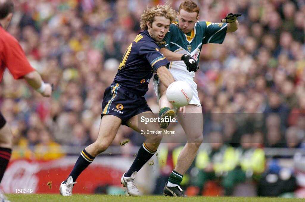 17 October 2004; Brendan Coulter, Ireland, in action against Mark McVeigh, Australia. Coca Cola International Rules Series 2004, First Test, Ireland v Australia, Croke Park, Dublin. Picture credit; Brendan Moran / SPORTSFILE *** Local Caption *** Any photograph taken by SPORTSFILE during, or in connection with, the 2004 Coca Cola International Rules Series which displays GAA logos or contains an image or part of an image of any GAA intellectual property, or, which contains images of a GAA player/players in their playing uniforms, may only be used for editorial and non-advertising purposes.  Use of photographs for advertising, as posters or for purchase separately is strictly prohibited unless prior written approval has been obtained from the Gaelic Athletic Association.