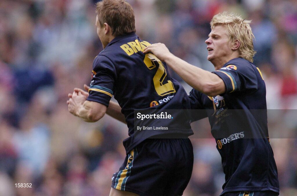 17 October 2004; Australia's Nick Riewoldt, right, congratulates team-mate Nathan Brown after Brown had scored a goal for his side. Coca Cola International Rules Series 2004, First Test, Ireland v Australia, Croke Park, Dublin. Picture credit; Brian Lawless / SPORTSFILE *** Local Caption *** Any photograph taken by SPORTSFILE during, or in connection with, the 2004 Coca Cola International Rules Series which displays GAA logos or contains an image or part of an image of any GAA intellectual property, or, which contains images of a GAA player/players in their playing uniforms, may only be used for editorial and non-advertising purposes.  Use of photographs for advertising, as posters or for purchase separately is strictly prohibited unless prior written approval has been obtained from the Gaelic Athletic Association.
