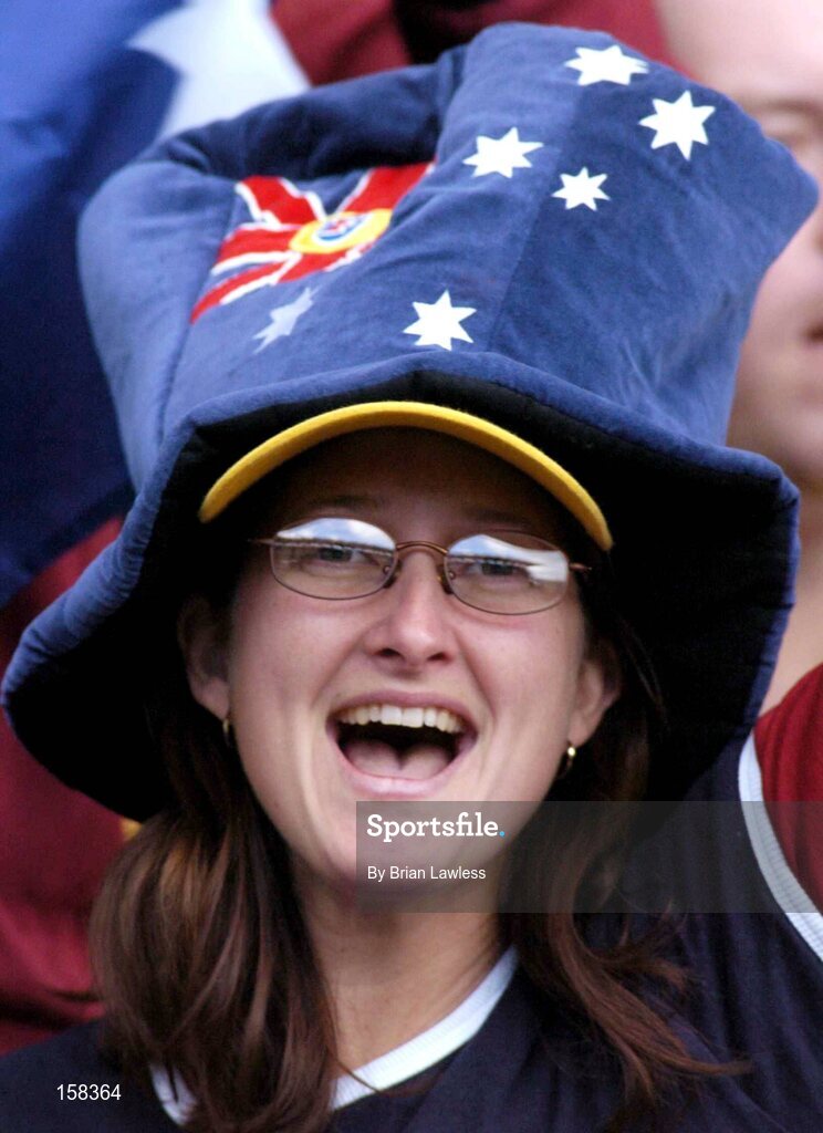 17 October 2004; An Australian fan cheers on her side during the match. Coca Cola International Rules Series 2004, First Test, Ireland v Australia, Croke Park, Dublin. Picture credit; Brian Lawless / SPORTSFILE *** Local Caption *** Any photograph taken by SPORTSFILE during, or in connection with, the 2004 Coca Cola International Rules Series which displays GAA logos or contains an image or part of an image of any GAA intellectual property, or, which contains images of a GAA player/players in their playing uniforms, may only be used for editorial and non-advertising purposes.  Use of photographs for advertising, as posters or for purchase separately is strictly prohibited unless prior written approval has been obtained from the Gaelic Athletic Association.