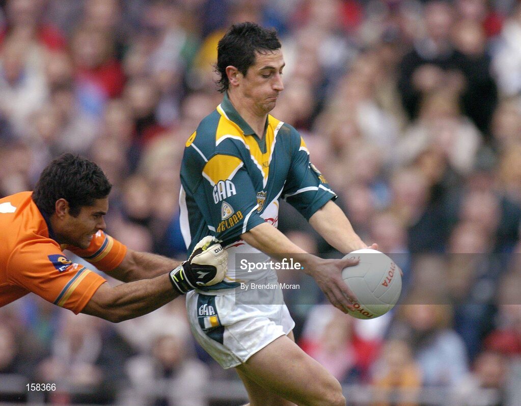 17 October 2004; Paul Galvin, Ireland, in action against Mal Michael, Australia. Coca Cola International Rules Series 2004, First Test, Ireland v Australia, Croke Park, Dublin. Picture credit; Brendan Moran / SPORTSFILE *** Local Caption *** Any photograph taken by SPORTSFILE during, or in connection with, the 2004 Coca Cola International Rules Series which displays GAA logos or contains an image or part of an image of any GAA intellectual property, or, which contains images of a GAA player/players in their playing uniforms, may only be used for editorial and non-advertising purposes.  Use of photographs for advertising, as posters or for purchase separately is strictly prohibited unless prior written approval has been obtained from the Gaelic Athletic Association.