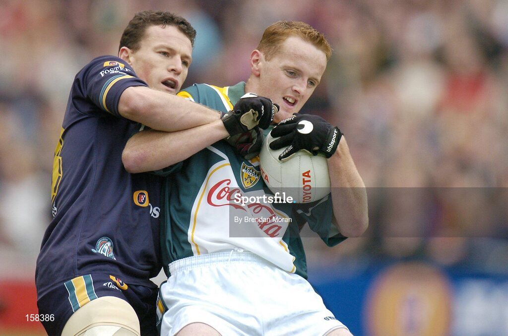 17 October 2004; Brendan Coulter, Ireland, in action against Jared Crouch, Australia. Coca Cola International Rules Series 2004, First Test, Ireland v Australia, Croke Park, Dublin. Picture credit; Brendan Moran / SPORTSFILE *** Local Caption *** Any photograph taken by SPORTSFILE during, or in connection with, the 2004 Coca Cola International Rules Series which displays GAA logos or contains an image or part of an image of any GAA intellectual property, or, which contains images of a GAA player/players in their playing uniforms, may only be used for editorial and non-advertising purposes.  Use of photographs for advertising, as posters or for purchase separately is strictly prohibited unless prior written approval has been obtained from the Gaelic Athletic Association.
