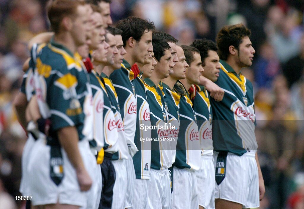 17 October 2004; The Ireland team stand together for the national anthem before the game. Coca Cola International Rules Series 2004, First Test, Ireland v Australia, Croke Park, Dublin. Picture credit; Brendan Moran / SPORTSFILE *** Local Caption *** Any photograph taken by SPORTSFILE during, or in connection with, the 2004 Coca Cola International Rules Series which displays GAA logos or contains an image or part of an image of any GAA intellectual property, or, which contains images of a GAA player/players in their playing uniforms, may only be used for editorial and non-advertising purposes.  Use of photographs for advertising, as posters or for purchase separately is strictly prohibited unless prior written approval has been obtained from the Gaelic Athletic Association.