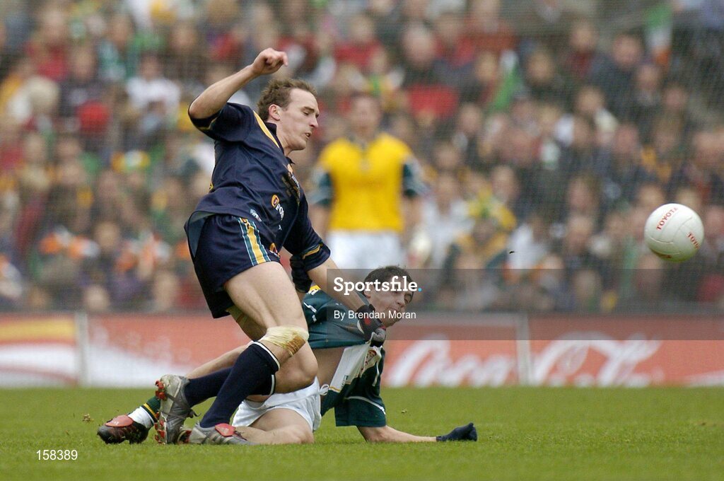 17 October 2004; Robert Haddrill, Australia, in action against Paul Galvin, Ireland. Coca Cola International Rules Series 2004, First Test, Ireland v Australia, Croke Park, Dublin. Picture credit; Brendan Moran / SPORTSFILE *** Local Caption *** Any photograph taken by SPORTSFILE during, or in connection with, the 2004 Coca Cola International Rules Series which displays GAA logos or contains an image or part of an image of any GAA intellectual property, or, which contains images of a GAA player/players in their playing uniforms, may only be used for editorial and non-advertising purposes.  Use of photographs for advertising, as posters or for purchase separately is strictly prohibited unless prior written approval has been obtained from the Gaelic Athletic Association.