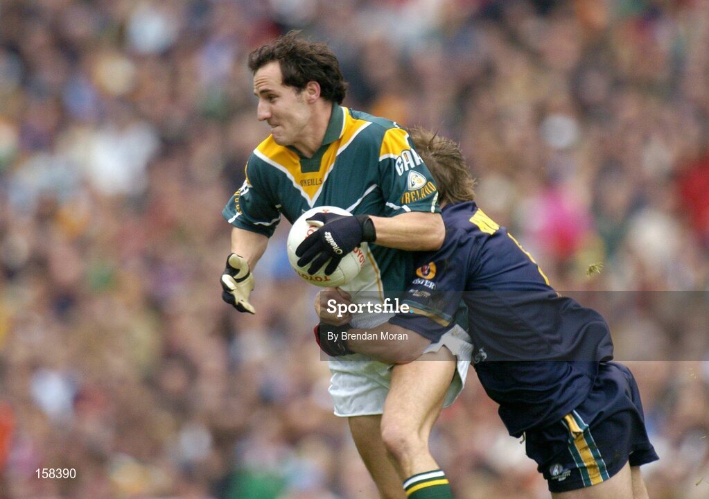 17 October 2004; Tadhg Kennelly, Ireland, in action against Max Hudghton, Australia. Coca Cola International Rules Series 2004, First Test, Ireland v Australia, Croke Park, Dublin. Picture credit; Brendan Moran / SPORTSFILE *** Local Caption *** Any photograph taken by SPORTSFILE during, or in connection with, the 2004 Coca Cola International Rules Series which displays GAA logos or contains an image or part of an image of any GAA intellectual property, or, which contains images of a GAA player/players in their playing uniforms, may only be used for editorial and non-advertising purposes.  Use of photographs for advertising, as posters or for purchase separately is strictly prohibited unless prior written approval has been obtained from the Gaelic Athletic Association.