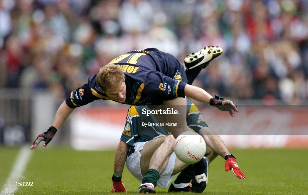 17 October 2004; Jason Johnson, Australia, in action against Steven McDonnell, Ireland. Coca Cola International Rules Series 2004, First Test, Ireland v Australia, Croke Park, Dublin. Picture credit; Brendan Moran / SPORTSFILE *** Local Caption *** Any photograph taken by SPORTSFILE during, or in connection with, the 2004 Coca Cola International Rules Series which displays GAA logos or contains an image or part of an image of any GAA intellectual property, or, which contains images of a GAA player/players in their playing uniforms, may only be used for editorial and non-advertising purposes.  Use of photographs for advertising, as posters or for purchase separately is strictly prohibited unless prior written approval has been obtained from the Gaelic Athletic Association.