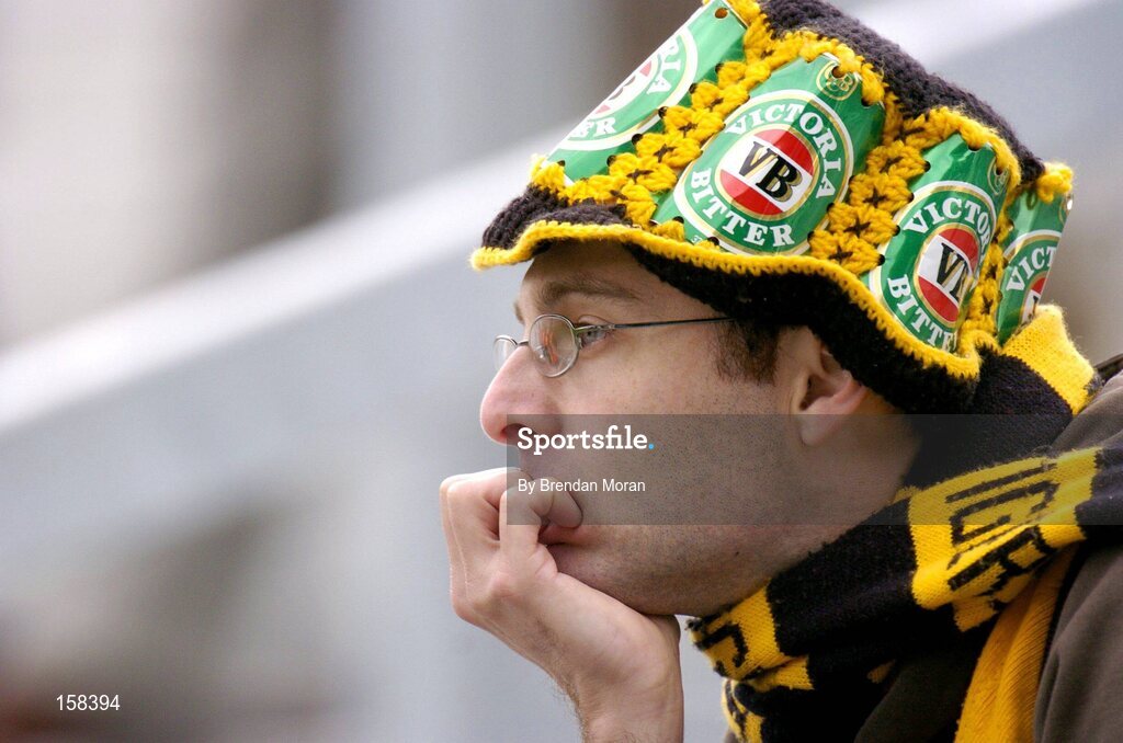 17 October 2004; An Australian supporter watches his side during their heavy defeat to Ireland. Coca Cola International Rules Series 2004, First Test, Ireland v Australia, Croke Park, Dublin. Picture credit; Brendan Moran / SPORTSFILE *** Local Caption *** Any photograph taken by SPORTSFILE during, or in connection with, the 2004 Coca Cola International Rules Series which displays GAA logos or contains an image or part of an image of any GAA intellectual property, or, which contains images of a GAA player/players in their playing uniforms, may only be used for editorial and non-advertising purposes.  Use of photographs for advertising, as posters or for purchase separately is strictly prohibited unless prior written approval has been obtained from the Gaelic Athletic Association.