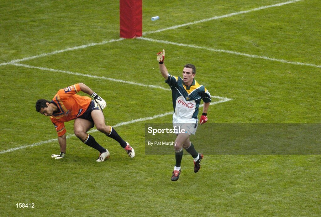 17 October 2004; Padraic Joyce, Ireland, celebrates after scoring a goal past Australian goalkeeper Mal Michael. Coca Cola International Rules Series 2004, First Test, Ireland v Australia, Croke Park, Dublin. Picture credit; Pat Murphy / SPORTSFILE *** Local Caption *** Any photograph taken by SPORTSFILE during, or in connection with, the 2004 Coca Cola International Rules Series, which displays GAA logos or contains an image or part of an image of any GAA intellectual property, or, which contains images of a GAA player/players in their playing uniforms, may only be used for editorial and non-advertising purposes. Use of photographs for advertising, as posters or for purchase separately is strictly prohibited unless prior written approval has been obtained from the Gaelic Athletic Association.