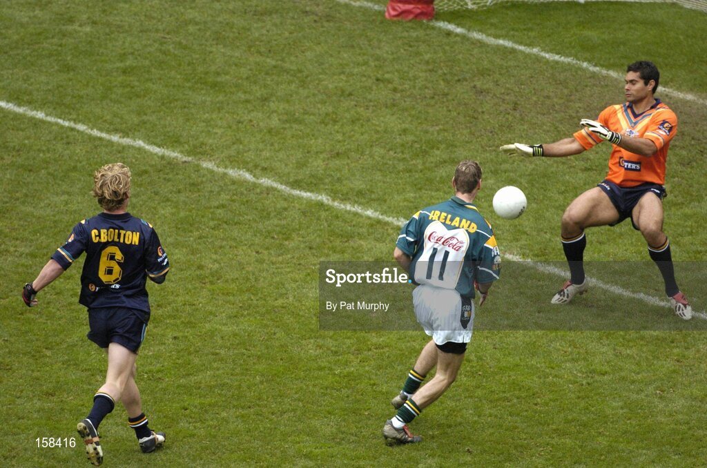 17 October 2004; Matty Forde, Ireland, scores a goal past Australian goalkeeper Mal Michael. Coca Cola International Rules Series 2004, First Test, Ireland v Australia, Croke Park, Dublin. Picture credit; Pat Murphy / SPORTSFILE *** Local Caption *** Any photograph taken by SPORTSFILE during, or in connection with, the 2004 Coca Cola International Rules Series, which displays GAA logos or contains an image or part of an image of any GAA intellectual property, or, which contains images of a GAA player/players in their playing uniforms, may only be used for editorial and non-advertising purposes.  Use of photographs for advertising, as posters or for purchase separately is strictly prohibited unless prior written approval has been obtained from the Gaelic Athletic Association.
