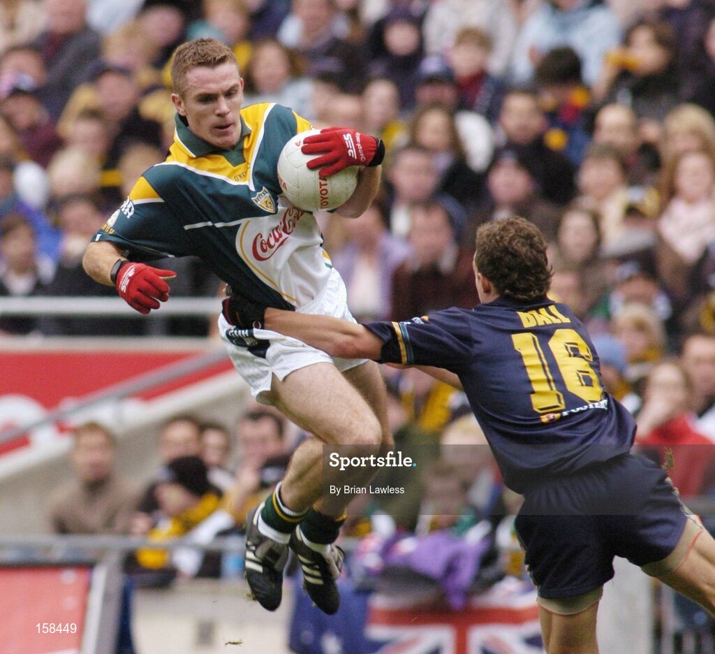 17 October 2004; Martin McGrath, Ireland, in action against Luke Ball, Australia. Coca Cola International Rules Series 2004, First Test, Ireland v Australia, Croke Park, Dublin. Picture credit; Brian Lawless / SPORTSFILE *** Local Caption *** Any photograph taken by SPORTSFILE during, or in connection with, the 2004 Coca Cola International Rules Series which displays GAA logos or contains an image or part of an image of any GAA intellectual property, or, which contains images of a GAA player/players in their playing uniforms, may only be used for editorial and non-advertising purposes.  Use of photographs for advertising, as posters or for purchase separately is strictly prohibited unless prior written approval has been obtained from the Gaelic Athletic Association.