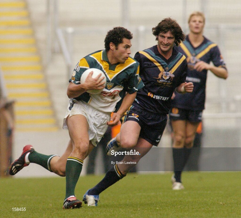 17 October 2004; Sean Og O'hAilpin, Ireland, in action against Brett Kirk, Australia. Coca Cola International Rules Series 2004, First Test, Ireland v Australia, Croke Park, Dublin. Picture credit; Brian Lawless / SPORTSFILE *** Local Caption *** Any photograph taken by SPORTSFILE during, or in connection with, the 2004 Coca Cola International Rules Series which displays GAA logos or contains an image or part of an image of any GAA intellectual property, or, which contains images of a GAA player/players in their playing uniforms, may only be used for editorial and non-advertising purposes.  Use of photographs for advertising, as posters or for purchase separately is strictly prohibited unless prior written approval has been obtained from the Gaelic Athletic Association.