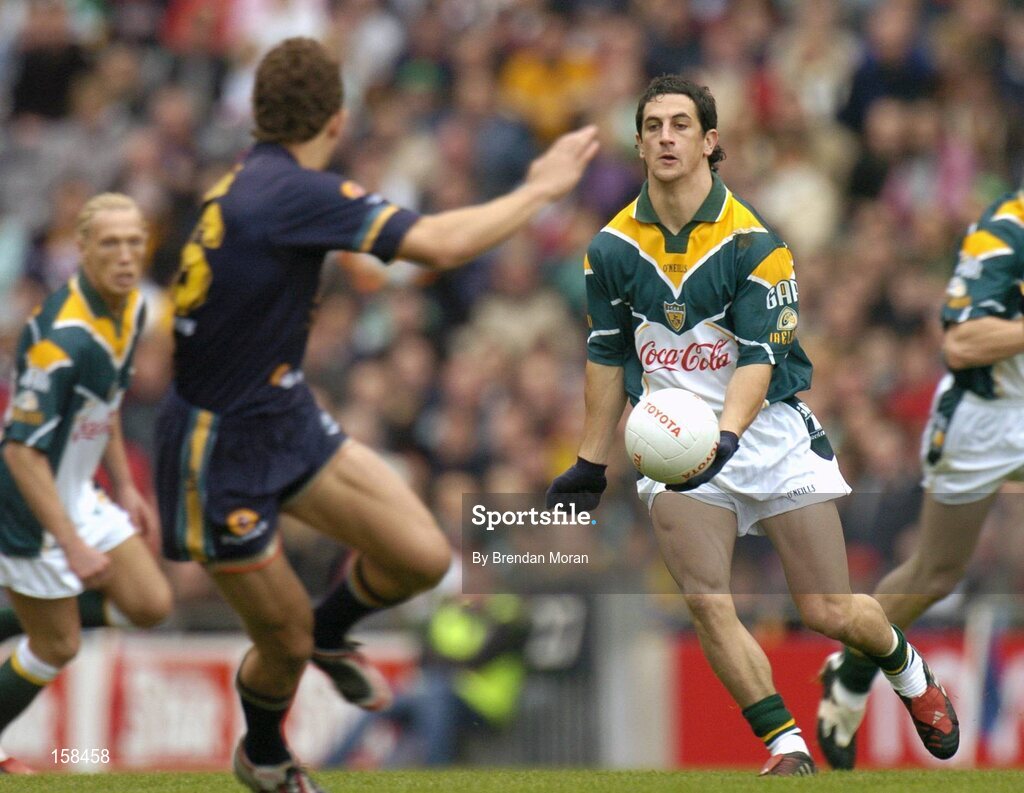 17 October 2004; Paul Galvin, Ireland, in action against Luke Ball, Australia. Coca Cola International Rules Series 2004, First Test, Ireland v Australia, Croke Park, Dublin. Picture credit; Brendan Moran / SPORTSFILE *** Local Caption *** Any photograph taken by SPORTSFILE during, or in connection with, the 2004 Coca Cola International Rules Series which displays GAA logos or contains an image or part of an image of any GAA intellectual property, or, which contains images of a GAA player/players in their playing uniforms, may only be used for editorial and non-advertising purposes.  Use of photographs for advertising, as posters or for purchase separately is strictly prohibited unless prior written approval has been obtained from the Gaelic Athletic Association.